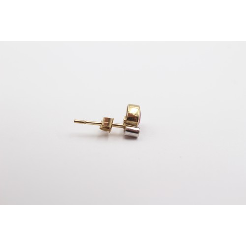 425 - A 9ct gold ruby and diamond pair of ear studs, 0.7gm