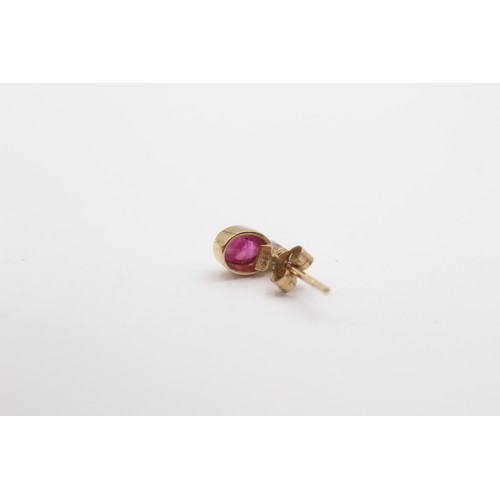 425 - A 9ct gold ruby and diamond pair of ear studs, 0.7gm