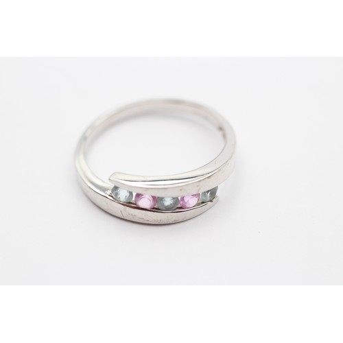 426 - A 9ct white gold pink sapphire and topaz dress ring, T, 3.3gm