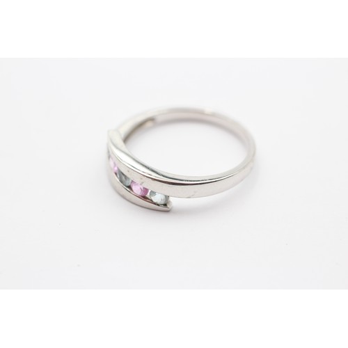 426 - A 9ct white gold pink sapphire and topaz dress ring, T, 3.3gm