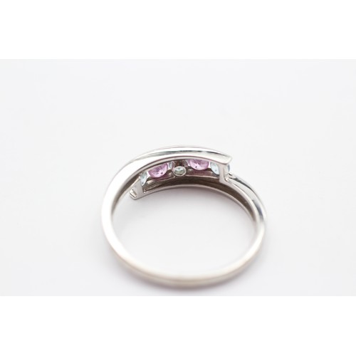 426 - A 9ct white gold pink sapphire and topaz dress ring, T, 3.3gm