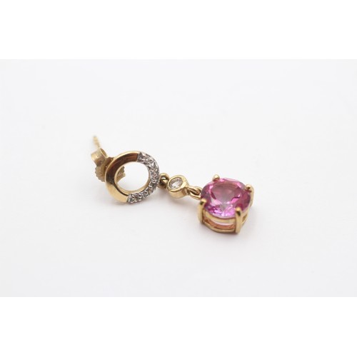 428 - A 9ct gold pair of diamond and pink stone ear rings, 23mm, 2.7gm