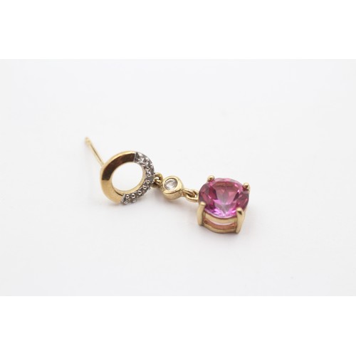 428 - A 9ct gold pair of diamond and pink stone ear rings, 23mm, 2.7gm