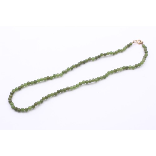 429 - A single row 4mm nephrite jade bead necklace, 38cm