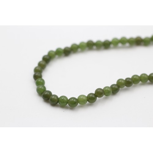 429 - A single row 4mm nephrite jade bead necklace, 38cm