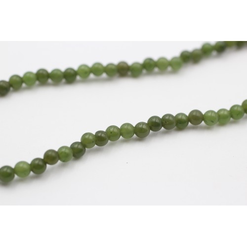 429 - A single row 4mm nephrite jade bead necklace, 38cm