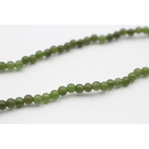 429 - A single row 4mm nephrite jade bead necklace, 38cm