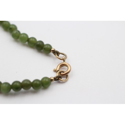 429 - A single row 4mm nephrite jade bead necklace, 38cm