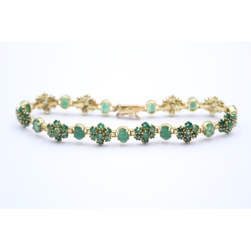 430 - A 14K gold emerald and treated emerald cluster bracelet, 18cm, 12.3gm.