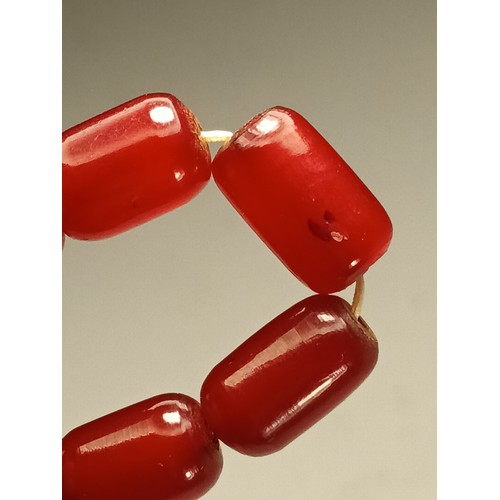 143 - A cherry red amber Bakelite graduated bead necklace, 25 - 12mm beads, 92cm, 96gm