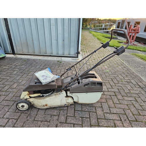 19 - An Alko 42BWE self propelled petrol lawnmower with basket and instructions and a Bosh hover mower AL... 