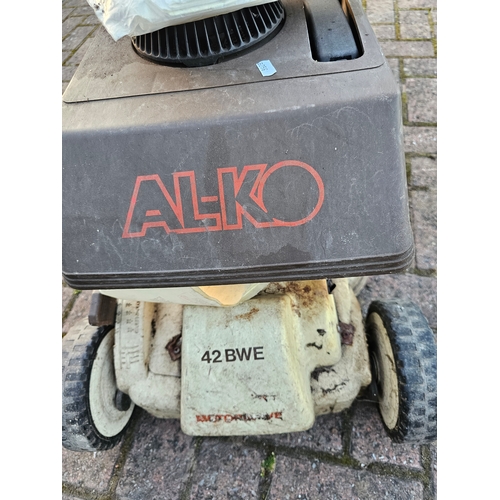 19 - An Alko 42BWE self propelled petrol lawnmower with basket and instructions and a Bosh hover mower AL... 
