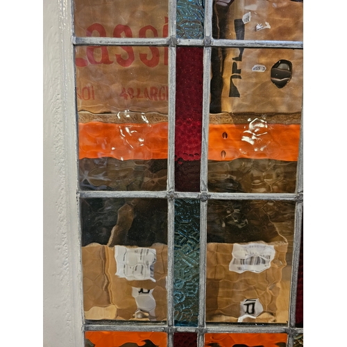 25 - An Art Deco era glazed front door, with leaded coloured and textured panel, 80.5 x 199.5cm, together... 
