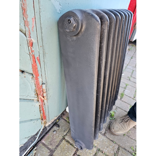 39 - An Ideal cast iron 8 division radiator, 56 x 72cm, and another smaller radiator, no brackets.