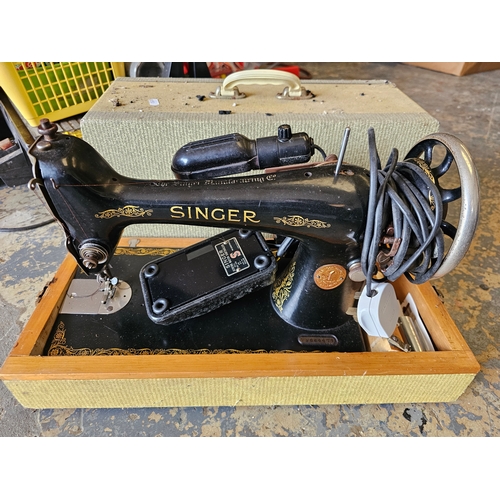 A Singer electric sewing machine, model number Y2664474, carry case All