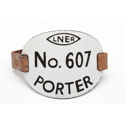 127 - An L.N.E.R porters metal numbered armband, 'L.N.E.R No 607 porter'.