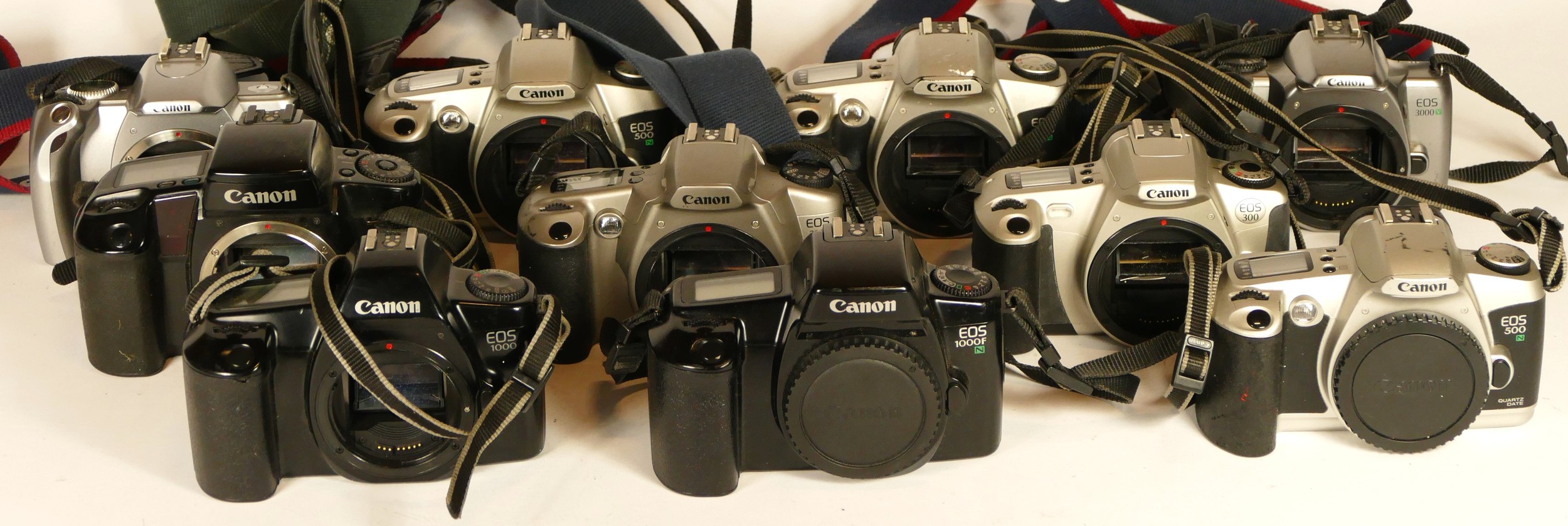 Ten Canon film camera bodies to include an EOS 300, an EOS 1...