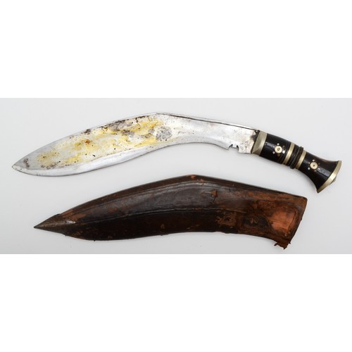 481 - An Indian kukri, the 32cm blade pick dot decorated, with leather scabbard.
This bladed product is no... 