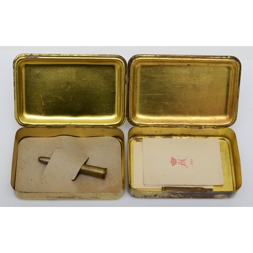 483 - A WWI Princess Mary 1914 Christmas gift box, containing a rifle cartridge, and another containing a ... 