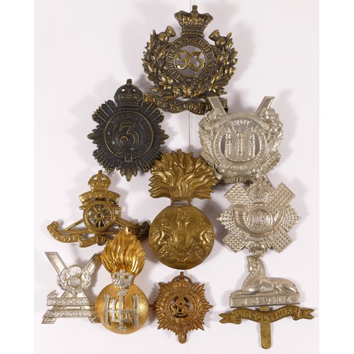 513 - Ten military cap badges, including Highland Light Infantry