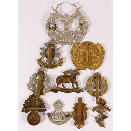 515 - Ten military cap badges, including East Lancashire and ATS