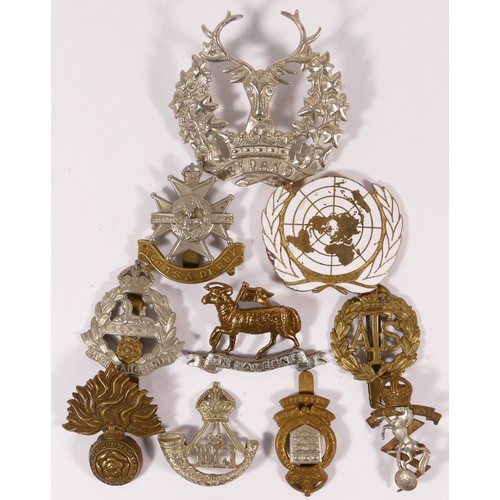 515 - Ten military cap badges, including East Lancashire and ATS