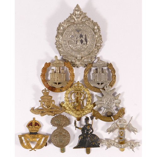 516 - Ten military cap badges, including Dorsetshire and Lancers