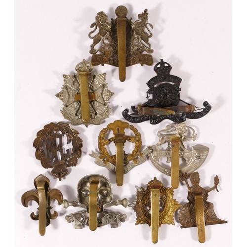 517 - Ten military cap badges, including Royal Flying Corps and Manchester Regt