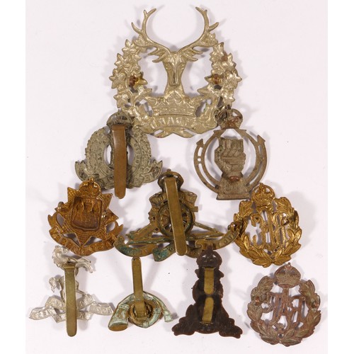 518 - Ten military cap badges, including Royal Armoured Corps and RAF