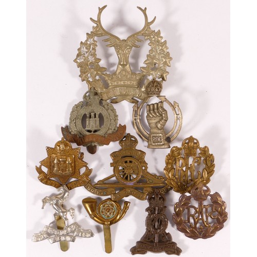 518 - Ten military cap badges, including Royal Armoured Corps and RAF