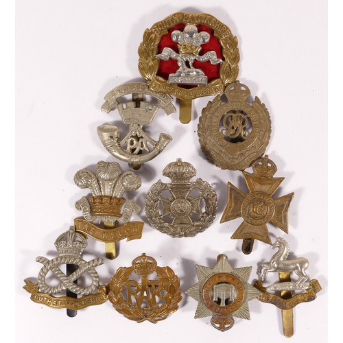 519 - Ten military cap badges, including South Lancs and South Staffs