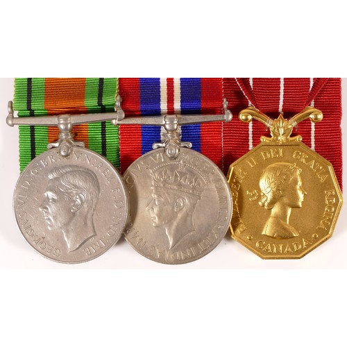 545 - WWII mounted group of three, including named Canadian Service Medal, named Captain M.R. Prentis