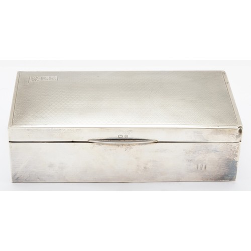 3 - A silver cigarette box, Birmingham 1929, with engine turned decoration, 18 x 9 x 5cm, cedarwood line... 