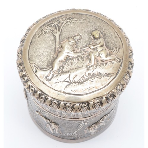 12 - An Indian silver pot with repoussé decorated landscape with animals, 6cm, 91gm.