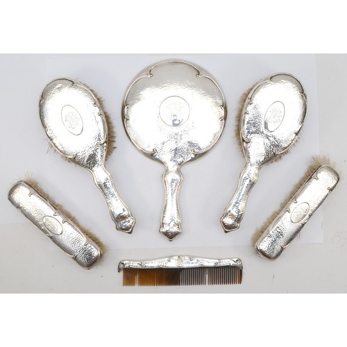 14 - An Edwardian silver mounted dressing table set, Birmingham and Chester 1908, with monogrammed cartou... 