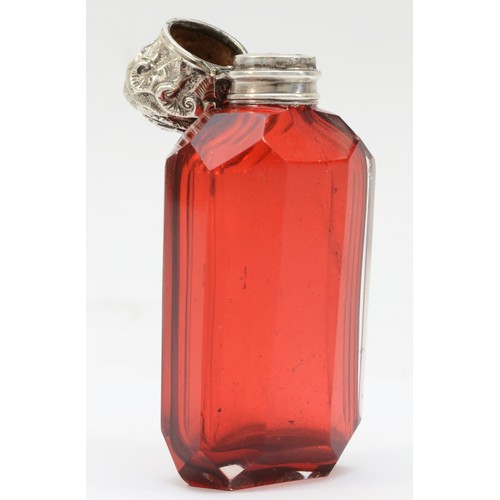 23 - A Victorian silver topped red glass scent bottle, 8.5cm.