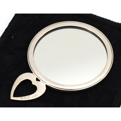 29 - An Elizabeth II silver travel mirror with chased scroll decoration, 8.5 x 6cm, Birmingham 1991, boxe... 