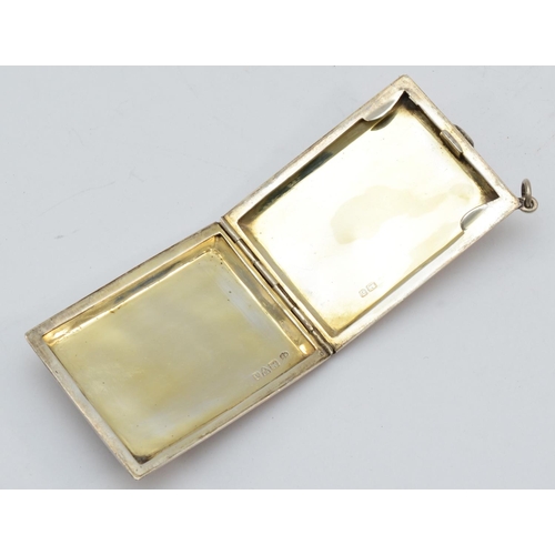 31 - A George V silver and gold plated match book holder with engine turned decoration, Chester 1926, 6 x... 