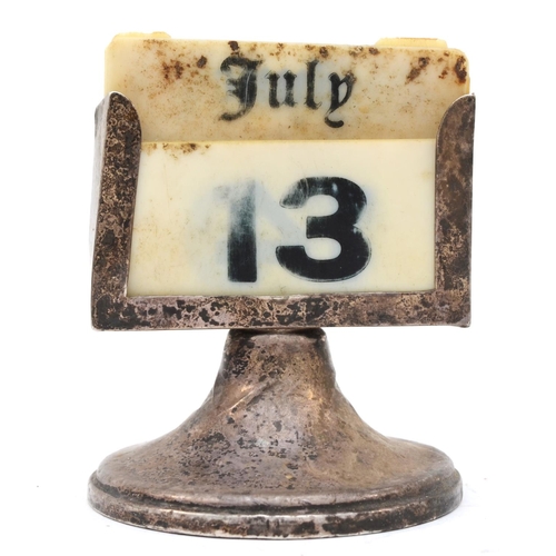 48 - A silver desk calendar, 8 x 6cm.