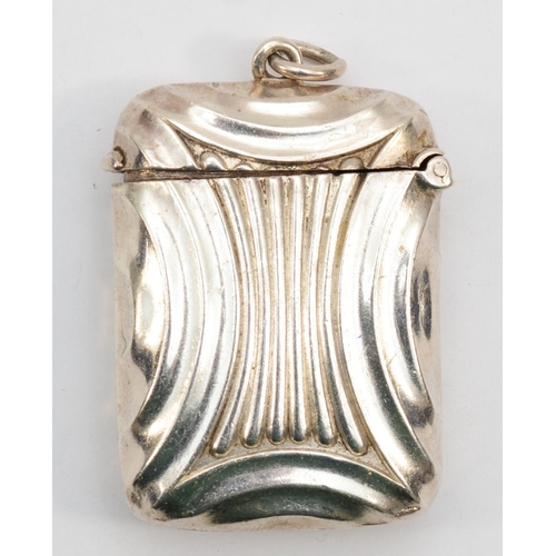 58 - An electroplated vesta case, with embossed decoration, 5 x 3.5cm.