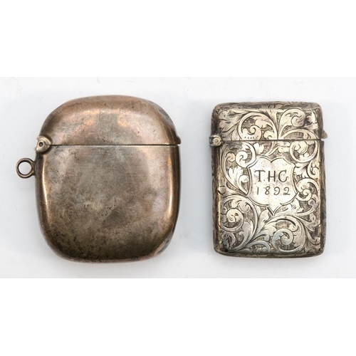 59 - A Victorian silver vesta case, Birmingham 1889, with chased scroll decoration, together with another... 