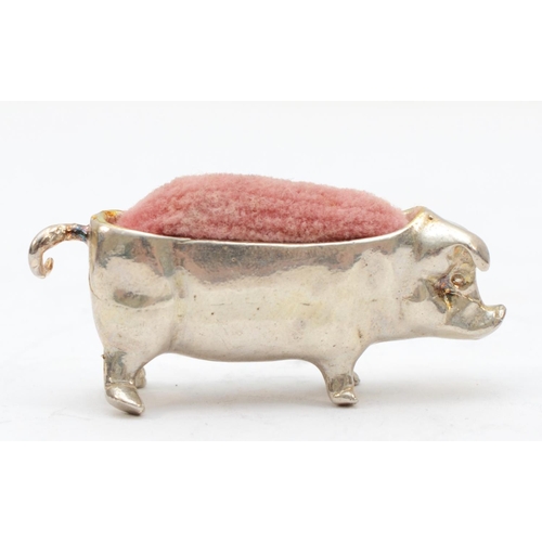 67 - An Elizabeth II silver pig pin cushion, London 1997, 4.5cm, 21gm.