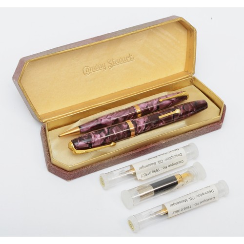 75 - A Conway Stewart fountain pen with 14k gold nib with a matching propelling pencil, cased and three l... 