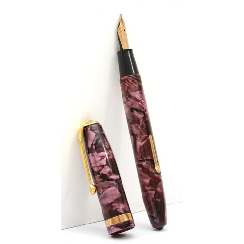 75 - A Conway Stewart fountain pen with 14k gold nib with a matching propelling pencil, cased and three l... 