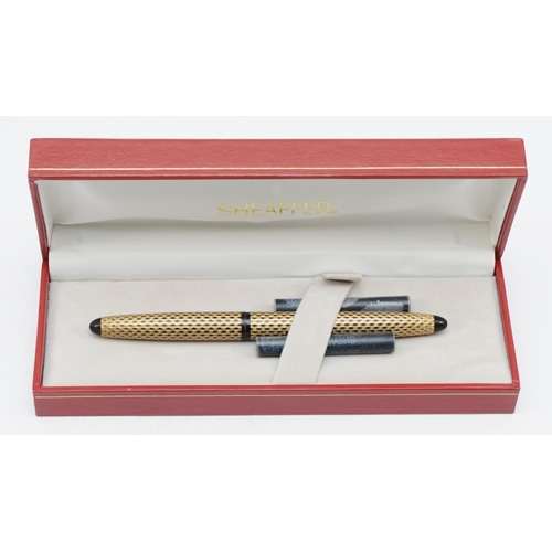 84 - Sheaffer, a boxed gold plated fountain pen, 13.5cm.