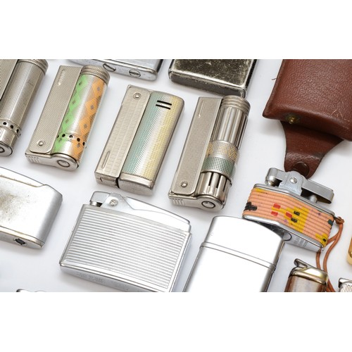 88 - A collection of predominantly petrol lighters to include Ronson, Zippo and others.