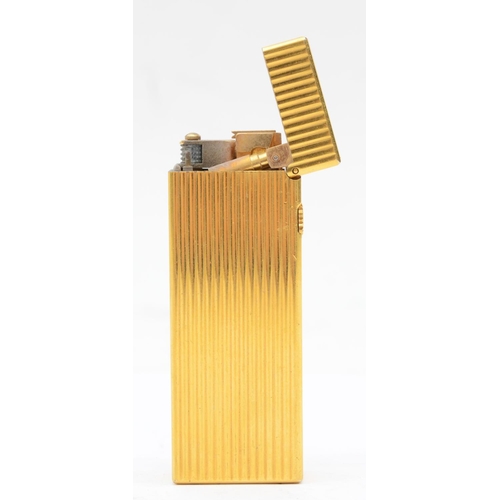 91 - Dunhill, a rollagas gold plated cigarette lighter, 6.5cm