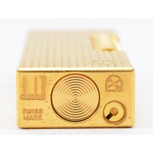 91 - Dunhill, a rollagas gold plated cigarette lighter, 6.5cm