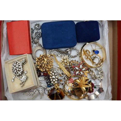 118 - A quantity of costume jewellery to include silver charms, beads, and fashion watches.