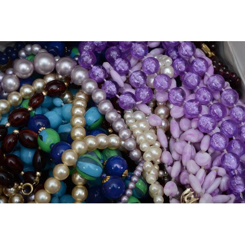 118 - A quantity of costume jewellery to include silver charms, beads, and fashion watches.